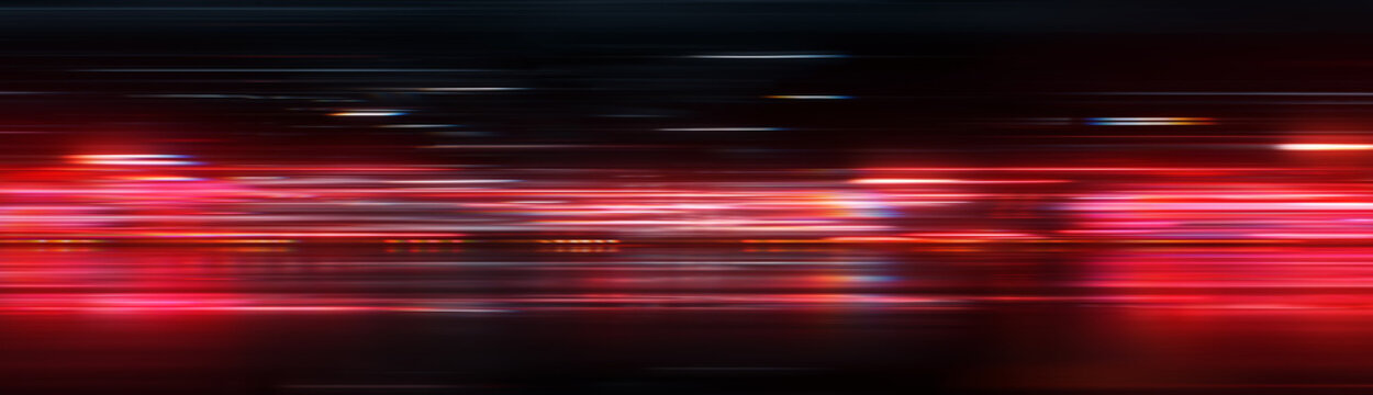 Cinematic anamorphic red light leaks and horizontal neon streaks. Abstract futuristic technology banner background with fast motion blur lines on dark backdrop. Dynamic neon speed trails panorama