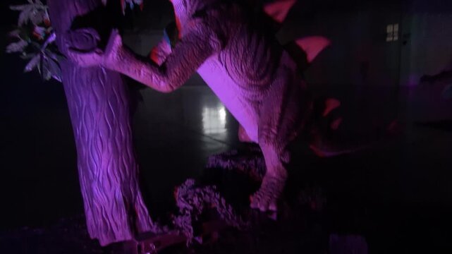Dinosaurs Ankylosaurus climbing eating leaves tree animatronic moving animal