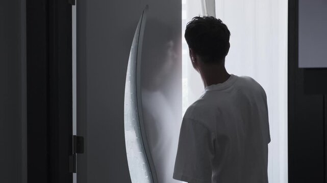 Agoraphobia and anxiety disorder concept with paranoid man secretly looking through curtain, fear of outside world, isolation and psychological stress