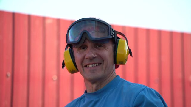 Worker In Safety Equipment Showing Thumbs Up