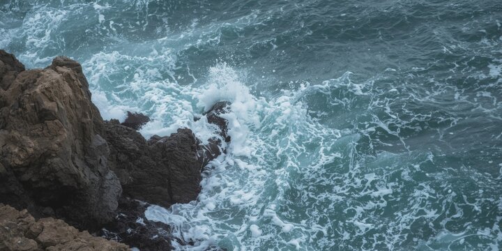 Energetic waves hitting natural rock formations by the sea