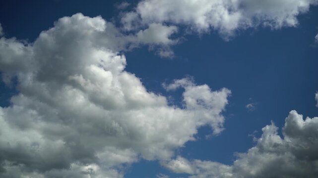 White Cumulus Clouds In Blue Sky