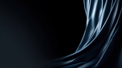 Naklejka premium Flowing drapery of dark, lustrous fabric cascades against a deep black background.