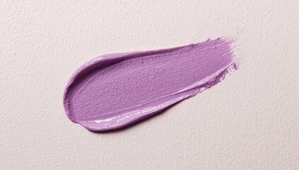 Fototapeta premium Detailed close up of a lavender lip stain on a neutral textured surface with copy space
