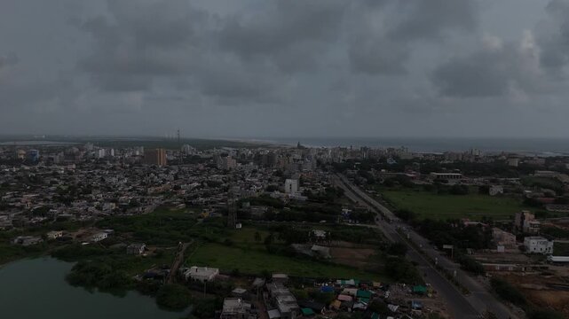 Wide aerial view of Dwarka city and the iconic Dwarkadhish Temple under cloudy sky