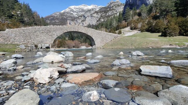 The Romanesque bridge of San Nicol&aacute;s de Bujaruelo, in the Bujaruelo Valley. Ordesa y Monte Perdido National Park, in the Pyrenees, Huesca. Aragon. Spain

