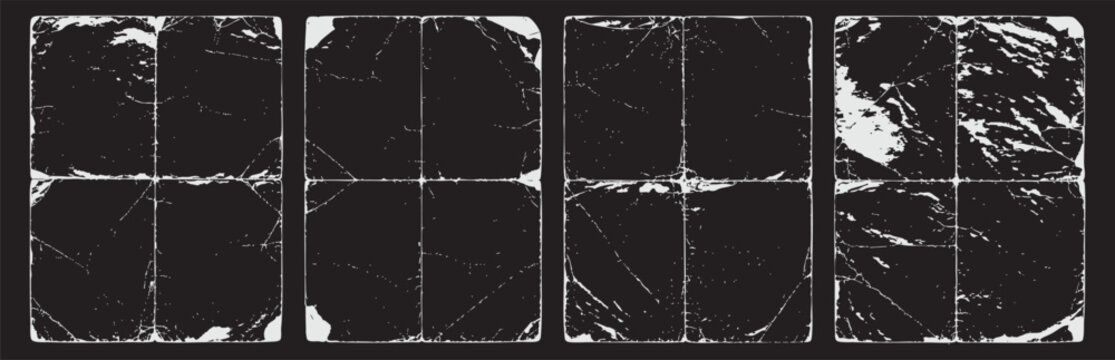 Collection of four distressed square grunge textures featuring folded paper creases, worn edges, and weathered surfaces isolated on a black background.