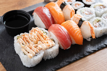 Assorted Sushi Selection and soy sauce on a Japanese restaurant table © chandlervid85