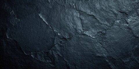 Naklejka premium Detailed slate stone surface texture on a dark black background ideal for creative design