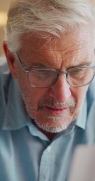 Paperwork, confused and old man in home with debt, insurance or letter of retirement risk. Thinking, worried and senior person reading of documents for financial mistake, bills or investment problem
