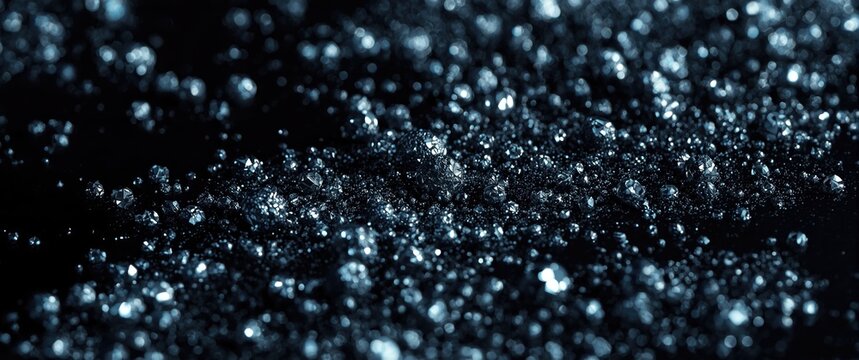 Close up view of ir pyrites glittering on a dark glossy reflective surface