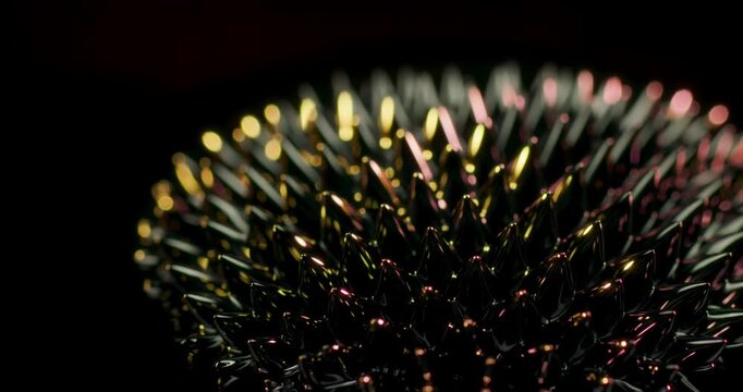 A detailed closeup of ferrofluid reveals vibrant colors and complex shapes, making it perfect for enhancing motion graphics and crafting captivating visual effects seen in modern artistic design