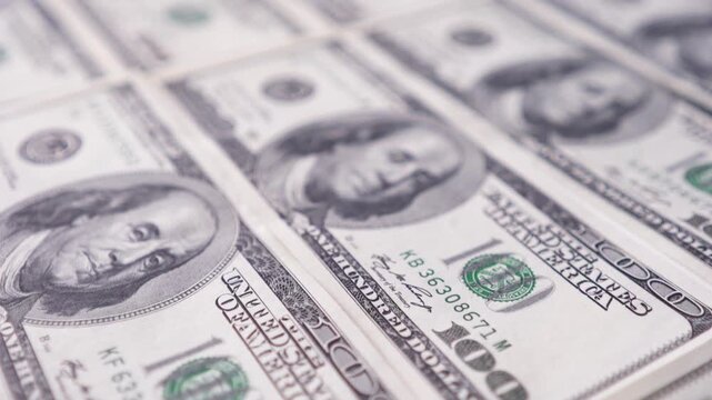 Top view of US one hundred dollar bills pattern. Financial background.