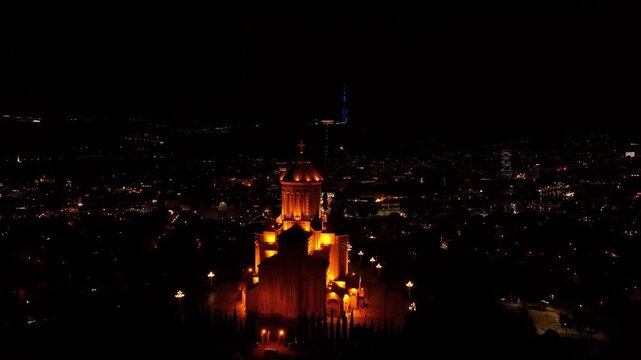 Cinematic night flight around Holy Trinity Cathedral in Tbilisi. Spectacular lighting highlights the grandeur of Georgia&rsquo;s iconic religious landmark.