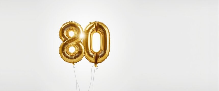 Glowing gold number 80 balloon display on white background for milestone birthday greeting cards