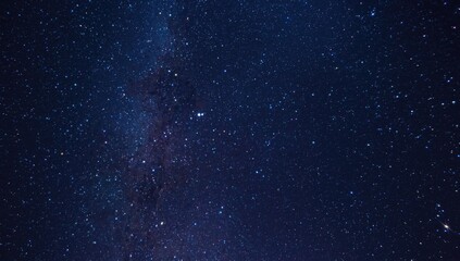 Fototapeta premium Dynamic colorful star loaded night sky astronomical background
