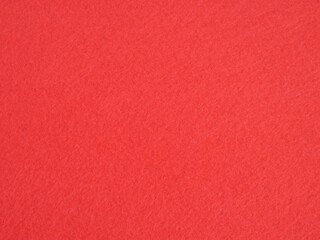 Fototapeta premium Red felt fabric texture background with soft synthetic fibers close up