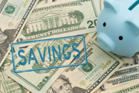 Savings rubber stamp with a piggy bank on twenty dollar bills for retirement