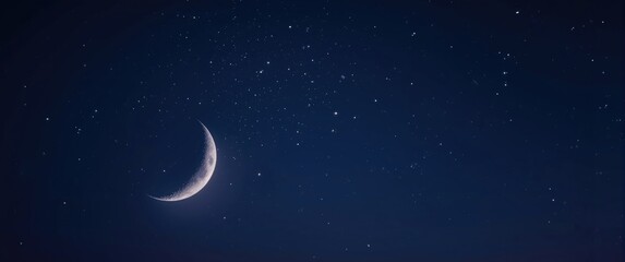 Naklejka premium crescent moon surrounded by radiant stars against deep night sky