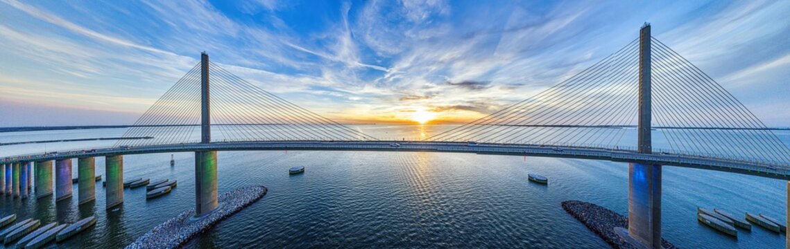 Sunrise over Sunshine Skyway Bridge aerial view Tampa Bay Florida