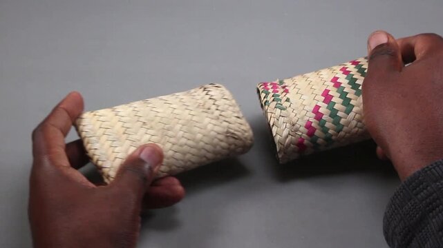 Hands Pouring a Collection of Euro Coins from Handwoven African Straw Pouches, Representing Microfinance, Personal Savings, Small Change Accumulation, and Immigrant Remittance Concepts