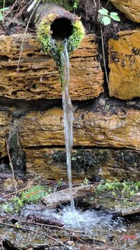 Stone pond with running water.