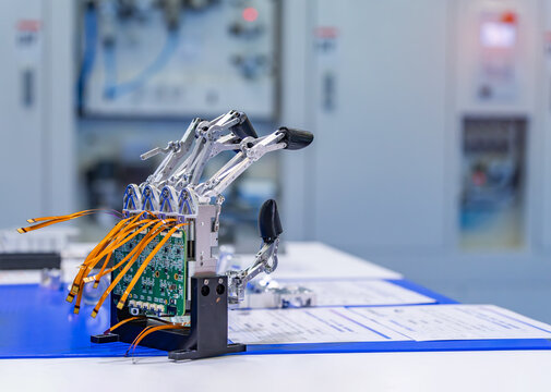 Artificial robotic hand at the presentation of robotics.Creation of artificial intelligence