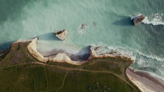Aerial top down view of chalk cliffs and sea stacks at Freshwater Bay