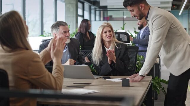 Professional team collaborates around a modern conference table
