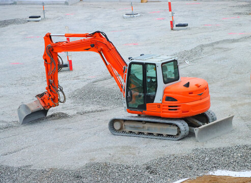 there is a digger working on construction site in swiss