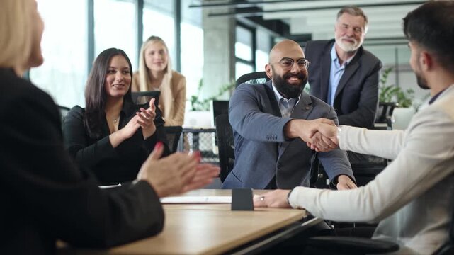 Professional men and women engage in a collaborative meeting