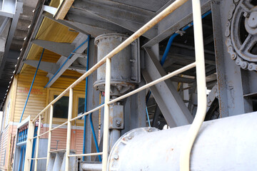 Fototapeta premium Vintage machinery stands at an industrial site in quiet decay