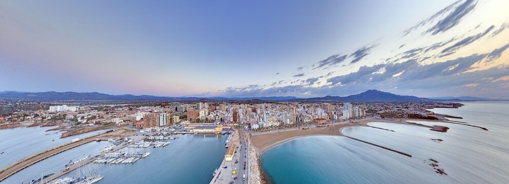 Aerial cityscape of Vinaros harbor at dawn