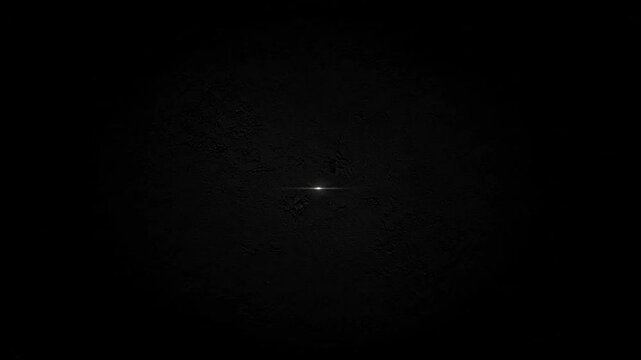 a small white spot in the dark.