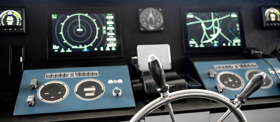 Digital dashboard with navigation monitor system, radar and VHF Radio in ship captain bridge or boat engine control room. Wheelhouse steering console on maritime transport. Nautical vessel technology © zephyr_p