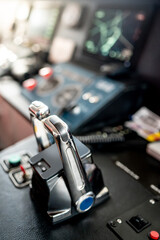 Throttle control on modern boat dashboard with navigation system and radar monitor screen in ship captain bridge or motorboat control room. Wheelhouse steering console. Nautical vessel technology © zephyr_p