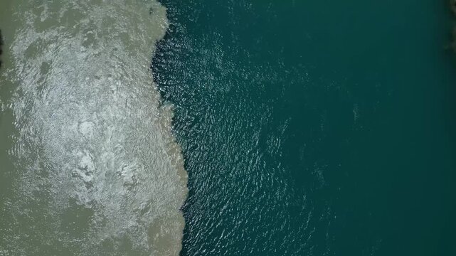 Drone Captures Shoreline And Ocean View. Сlear boundary on the water between clean and dirty water
