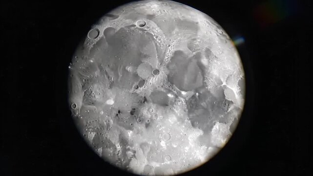 Two crescent moons framing a starry field in outer space