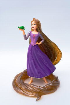 NAKHON PATHOM, THAILAND - 19 MAY 2026: A collectible figurine Disney Princess of Tangled Rapunzel holding her companion Pascal by Bandai Ichiban Kuji Figure on white background.