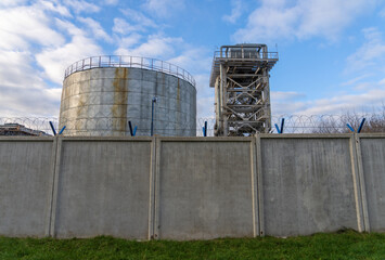 Obraz premium Industrial structure with safety features. Industrial environment including tanks and safety pathways