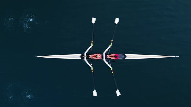 In beautiful Halifax, Nova Scotia, young athletes row in various boats during early morning training. The tranquil ocean scene captures their dedication and spirit as the sun rises