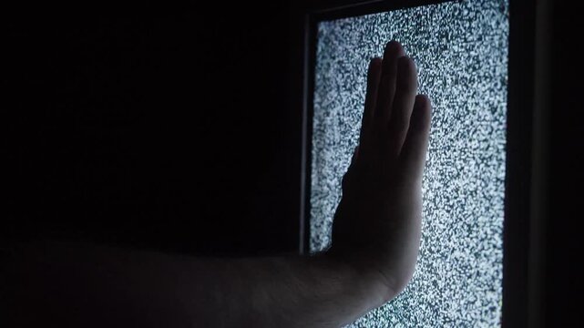 Distorted Television Screen Glitch Effect in Dark Room