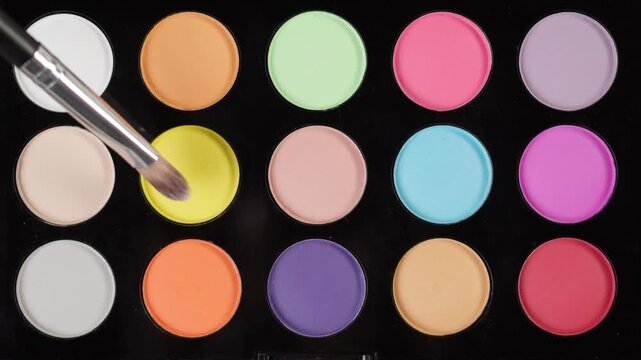Colorful Eyeshadow Palette with Makeup Brush Close-Up