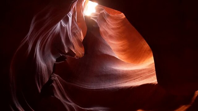 Sunlight illuminating the spectacular, smooth sandstone walls of the famous antelope canyon, a natural wonder with flowing rock formations located on navajo land east of page, arizona