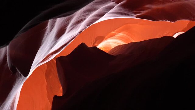 Famous red sandstone walls and smooth rock formations of the iconic slot canyon in arizona, showing the beautiful orange colors and light patterns created by sunlight filtering from above