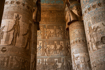 Ancient Egypt temple stone columns hieroglyphics painted ceiling vertical interior.  © Yar