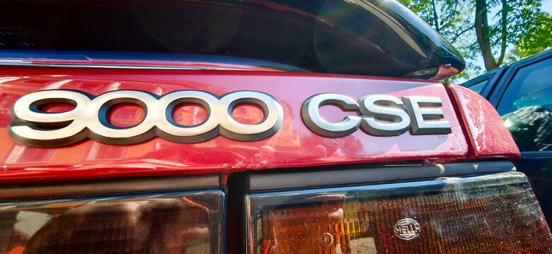 Saint Petersburg, Russia - May 23, 2026: Saab 9000 CSE badge on a red car with sunlight reflecting off the surface, showcasing the vehicle's design and branding details