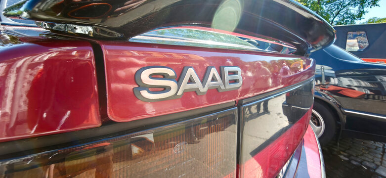 Saint Petersburg, Russia - May 23, 2026: Close-up view of a red Saab car badge with chrome lettering, showcasing the vehicle's distinctive design and rear features