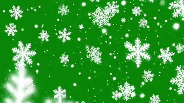 White snowflakes falling against a vibrant green background, creating a festive and wintery scene with a mix of large and small flakes.
