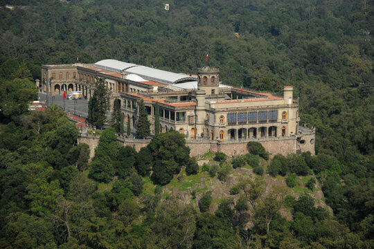 Aerial view of Chapultepec Castle with its historic stone architecture surrounded by the lush green forest of Chapultepec Park in Ciudad de Mexico, Ciudad de Mexico, Mexico.